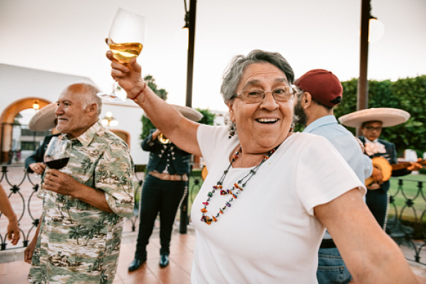 Senior woman dancing with family 